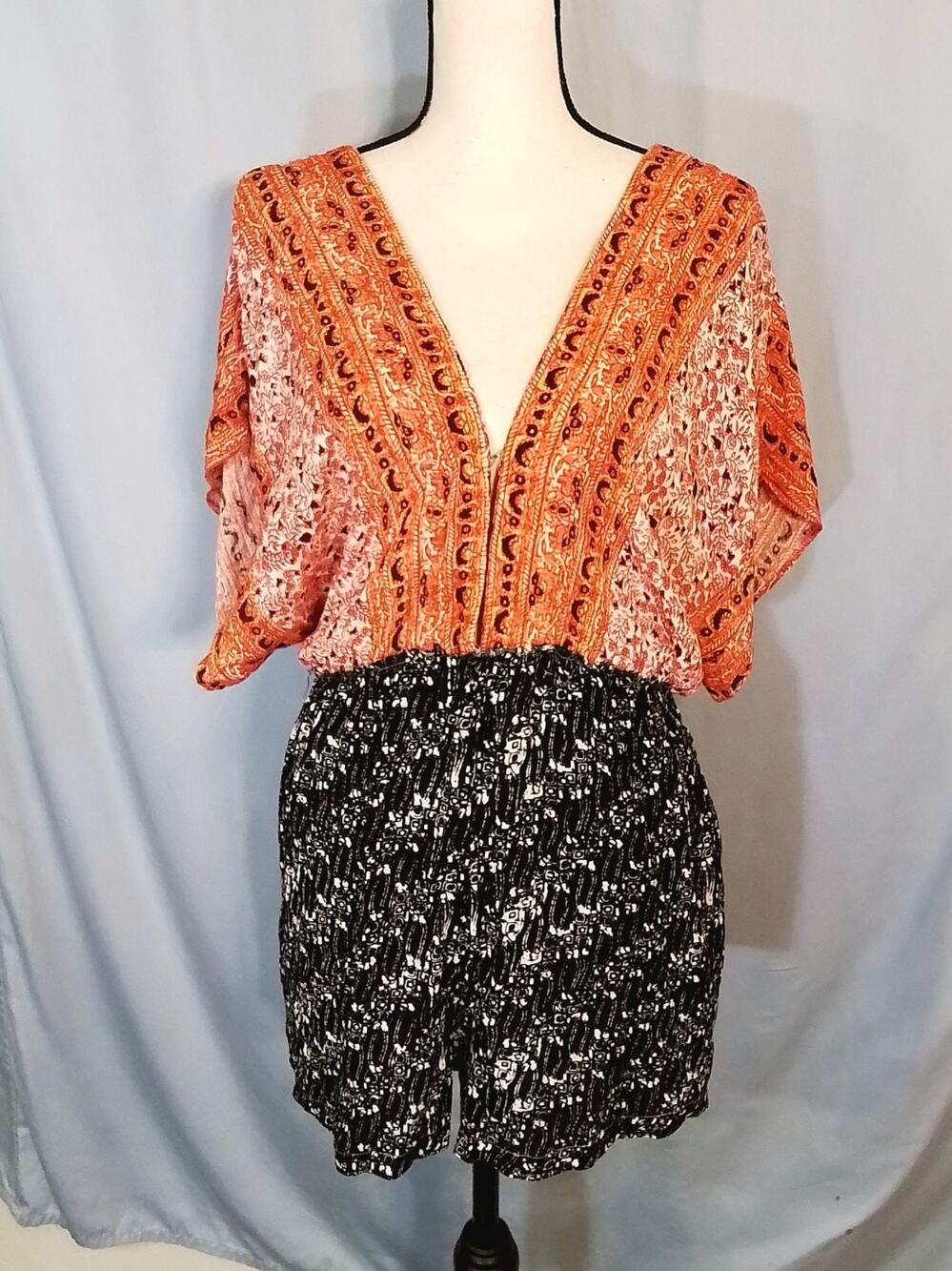 Free People, orange and black drop shoulder romper